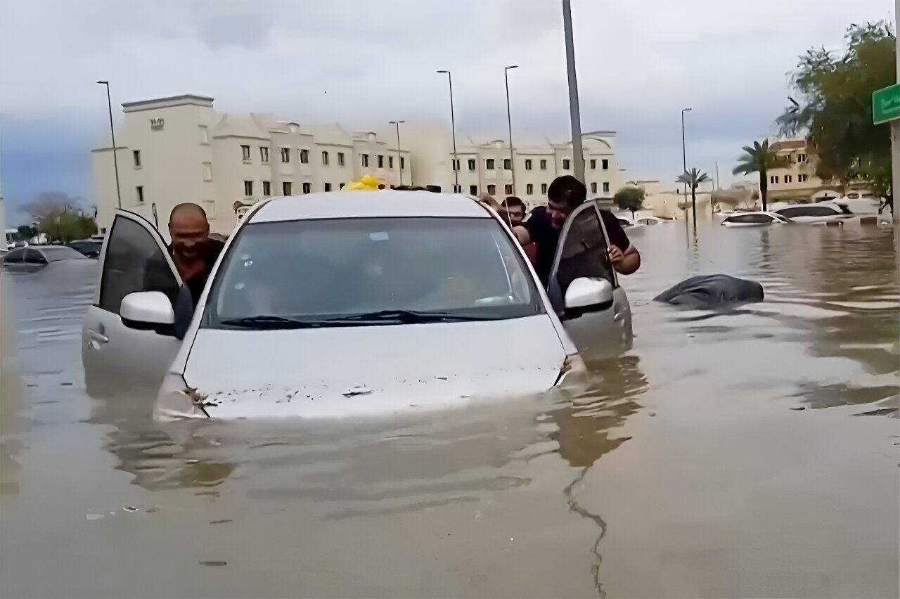 residents push a water
